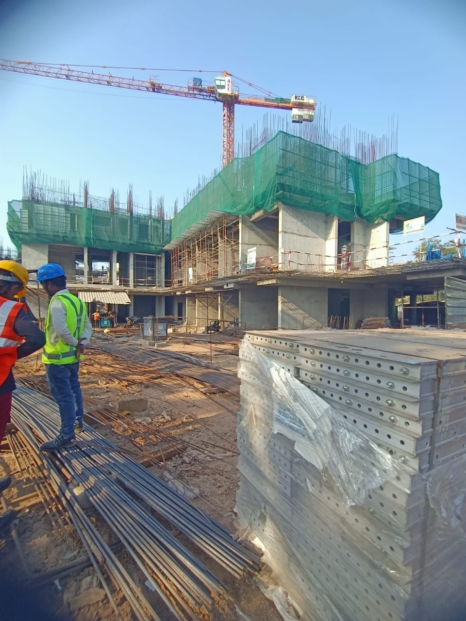 Construction workers at a large project site
