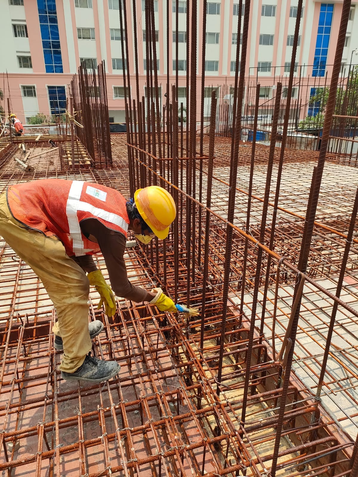 Construction worker binding reinforcement steel